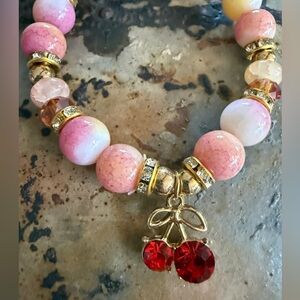 Elegant Pink and Red Beaded Bracelet with Gold Charm